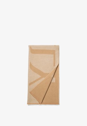 Beige Decke mit einem großen abstrakten Design in dunklerem Beige, aus weichem Stoff, mit einer umgeschlagenen Ecke, die eine glatte Textur zeigt.