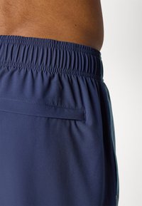 Under Armour UTILITY PANT - Tracksuit bottoms - washed navy/blue smoke/black
