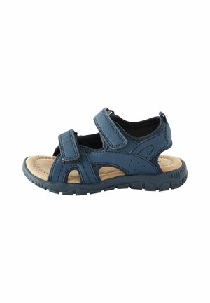 Blaue Lederandschuhe mit zwei verstellbaren Klettverschlüssen, durchbrochener Verzierung und einer gepolsterten, beigen Innensohle. Strapazierfähige Gummisohle mit Profil.