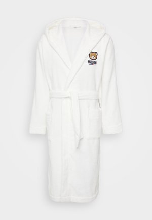 White terry bathrobe with a hood, featuring a bear logo and "MOSCHINO" text. Includes a tie belt and two front pockets. Soft texture.