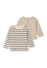 Two long-sleeve shirts: one is beige and the other is cream with navy stripes. Both have a ribbed texture and button detailing at the neck.