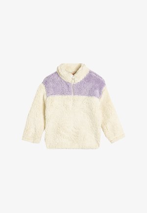 Creme- og lavendelfarvet farveblok fleece-pullover med lynlåskrave, der har et blødt, tekstureret stof og lange ærmer.