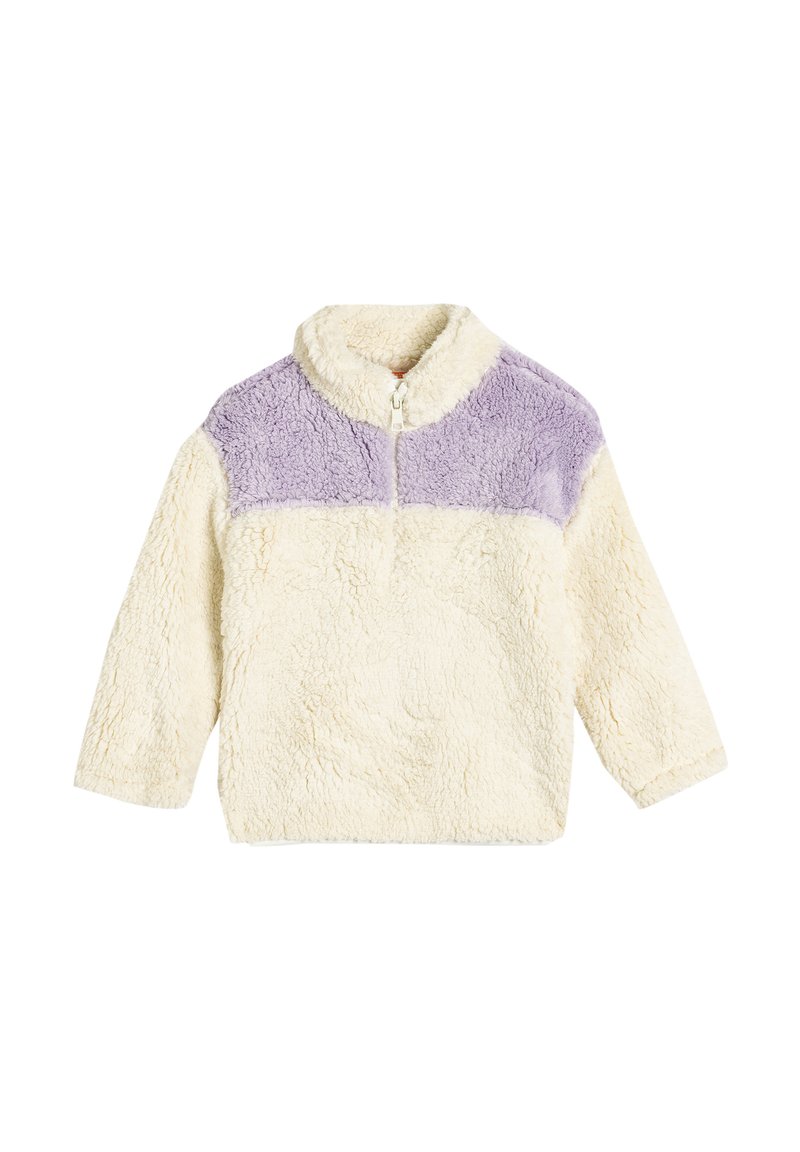 Pull en moleton color crème et lavande à bloc, avec un col zippé, mettant en avant un tissu doux et texturé et des manches longues.