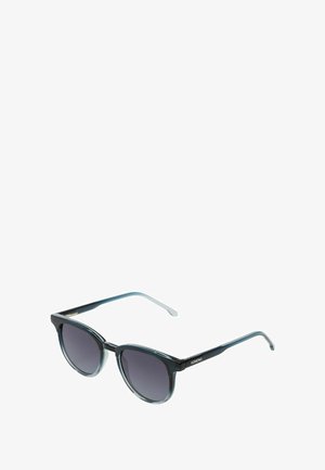 Lunettes de soleil avec une monture transparente de couleur bleu foncé, des verres ronds et de fines branches noires. Présente un accent métallique subtil sur la monture.