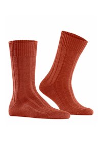 Skarpetki bawełniane w odcieniu rdzawym, o prążkowanej fakturze, z pionowymi paskami oraz wzmocnionym palcem i piętą dla większej trwałości.