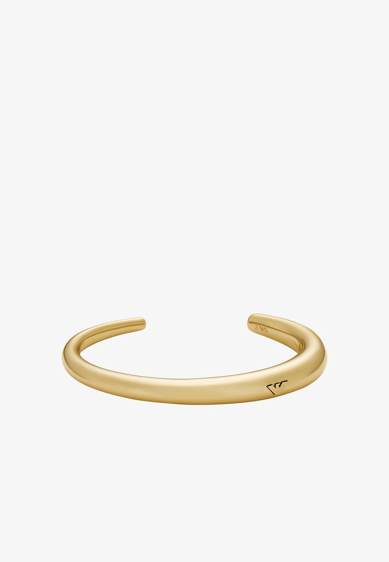 Bracelet jonc doré avec une forme lisse et arrondie et une finition polie. Présente un détail de logo gravé à une extrémité. Sans embellissements.