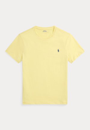 T-shirt jaune à manches courtes et col rond avec petit logo Polo Ralph Lauren bleu foncé sur la poitrine gauche.