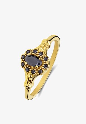 Bague en or avec une pierre précieuse noire ovale au centre, entourée de petites pierres noires rondes dans un sertissage orné.