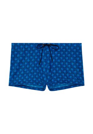 Siniset miesten uimashortsit, joissa on hienovaraiset aaltoilevat lehtikuviot ja musta kiristysnaru vyötäröllä.