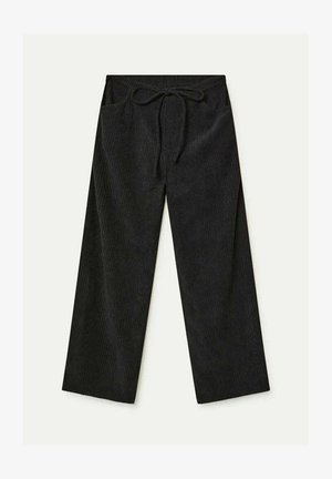 Pantalones de pana anchos y negros con cinturilla elástica y cordón, que cuentan con bolsillos frontales.