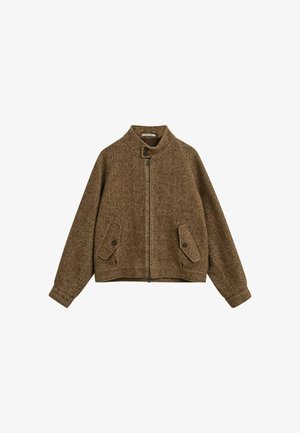 Brown herringbone jacket with a high collar, front zipper, and two patch pockets. Features a relaxed fit and textured fabric.