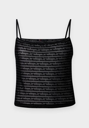 Top de tirantes tipo camisol con malla negra, que presenta un patrón repetido del logo "tommy" y un diseño ajustado. Tejido ligero con un ligero brillo.
