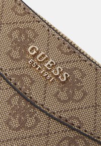 Guess Sac bandoulière - latte logo