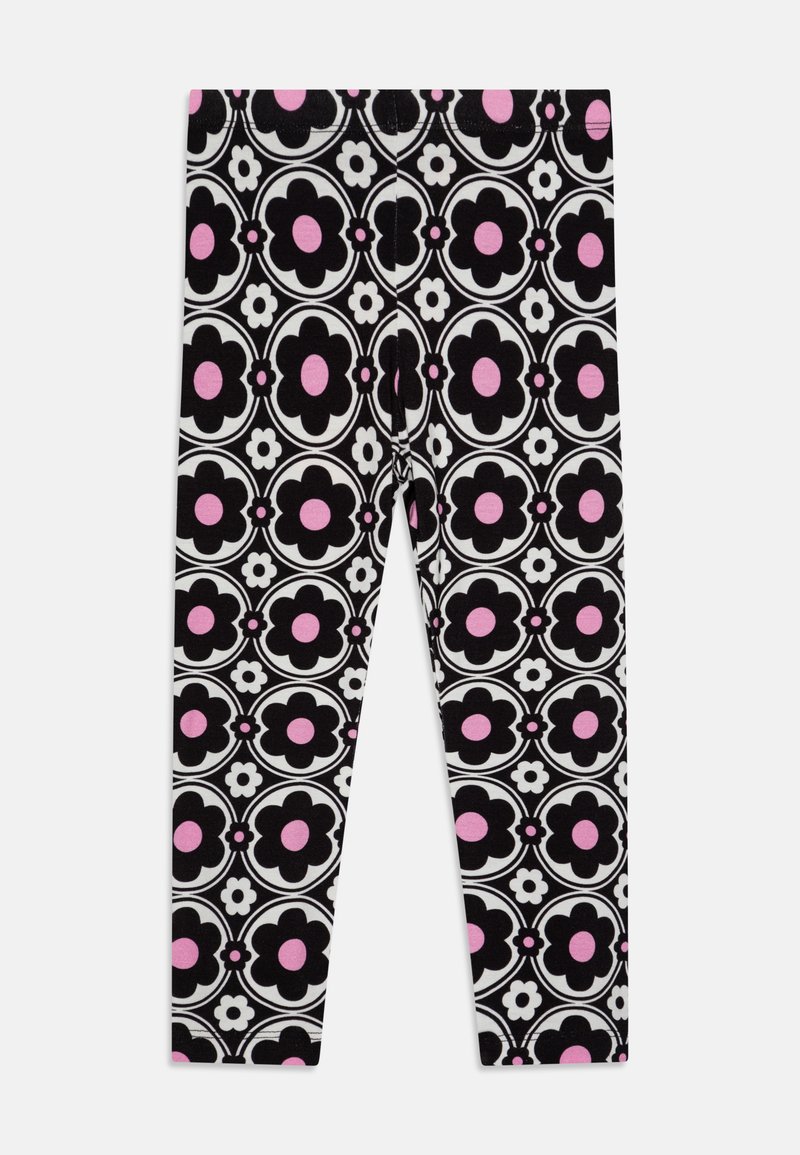 Leggings noirs ornés d'un motif floral audacieux avec des accents roses et blancs, fabriqués à partir d'un tissu doux et extensible.