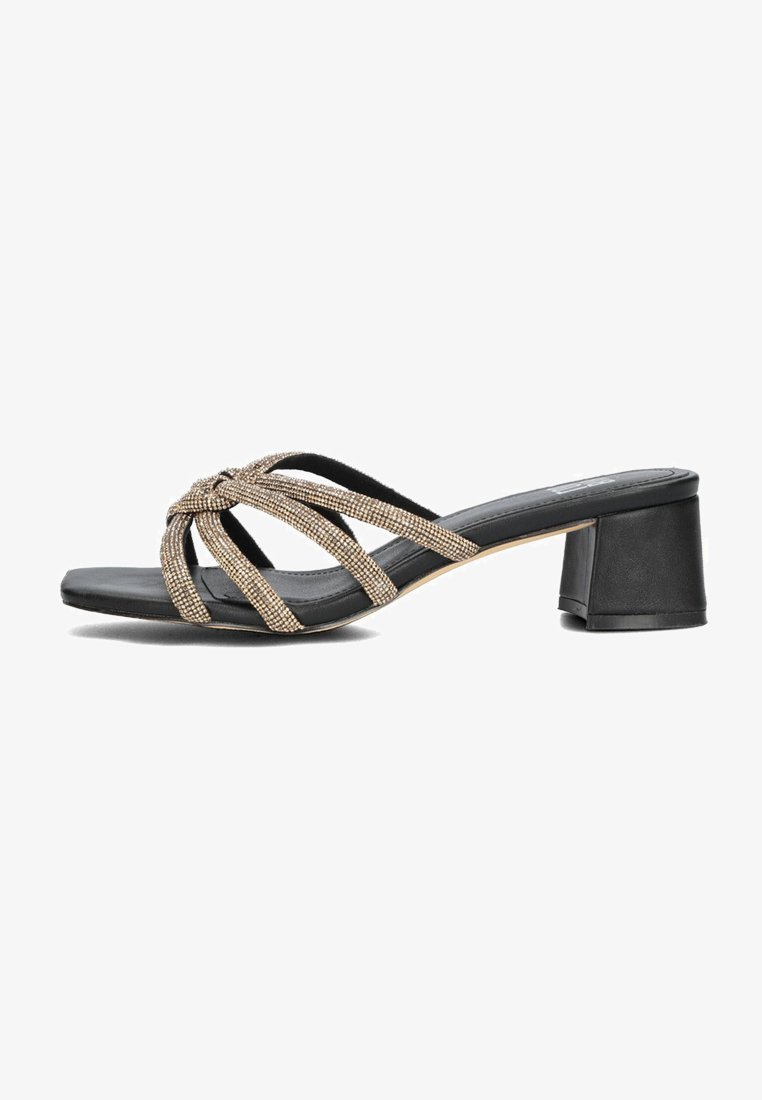 Black heeled sandals with a wide toe strap adorned with gold metallic detailing, featuring a block heel and a smooth sole.