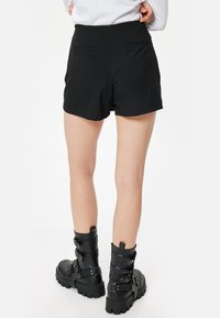 Koton SLIM FIT - Shorts - black