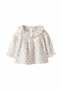 Balta ilgomis rankovėmis bluzonė su raukšlėta apykakle, dekoruota mažų palmės medžių raštu, pagaminta iš lengvo, tekstūruoto audinio.