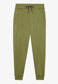 Joggers verdes hechos de una tela suave con cintura elástica, cordón negro, bolsillos laterales y puños acanalados en los tobillos.