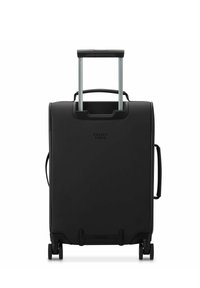 Valise rigide noire avec une poignée rétractable argentée, une poignée latérale et deux roues ; elle présente un design minimaliste avec le logo "Delsey Paris".