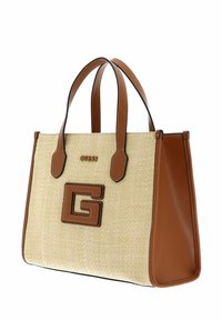 Sac en toile beige tissé avec des accents en faux cuir marron. Présente un logo "G" marron bien en vue et des doubles poignées, avec des détails en surpiqûre noire.
