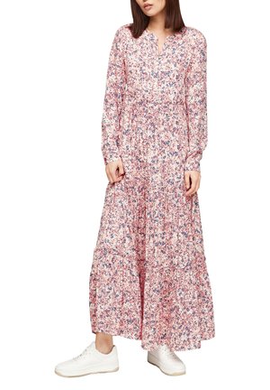 Floral maxi dress in pink with blue and purple accents, featuring a buttoned neckline and long sleeves, paired with white sneakers.