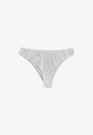 White women's bikini-style underwear with floral lace trim and textured fabric front panel, displayed on a plain background.