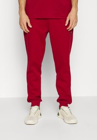Ellesse OSTERIA - Calças de fato de treino - burgundy