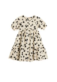 Robe florale beige avec motif de fleurs noires, manches courtes bouffantes, fermeture à boutons et jupe froncée avec poches. Matière en coton.