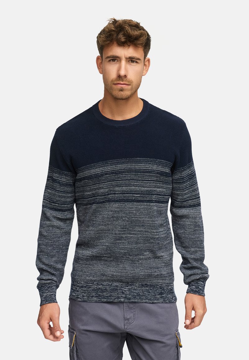Merensin navy blue -värinen neulepaita, jossa on vaakasuuntaiset tummanharmaat ja vaaleanharmaat raidat, pyöreä kaula-aukko ja pitkät hihat. Pehmeä rakenne.