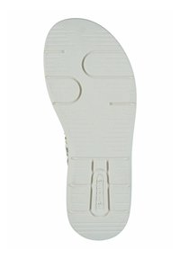 White rubber shoe sole featuring textured grip patterns, including horizontal and vertical lines, with embossed brand name "remonte."