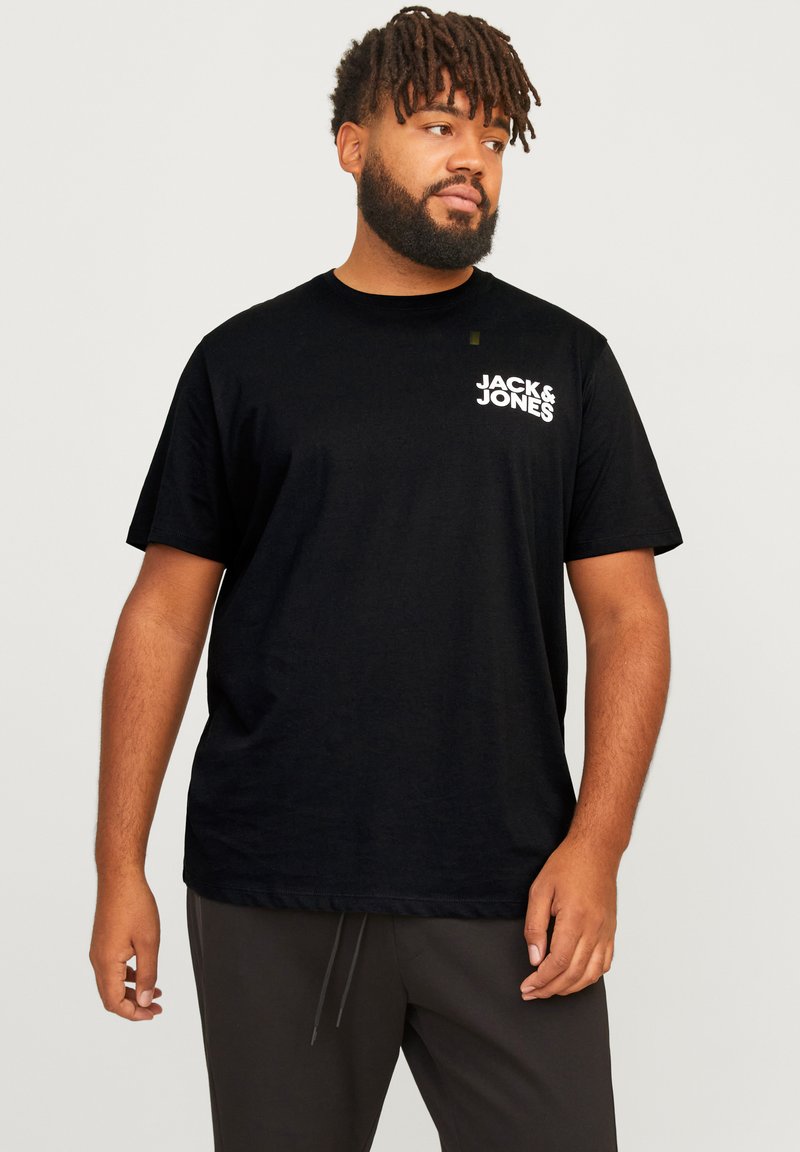 Black short-sleeve T-shirt made of cotton, featuring a white "Jack & Jones" logo on the left chest. Simple, straight-cut design.