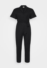 Black jumpsuit with short sleeves, a collar, and a belt at the waist. Positioned against a white background. Simple and stylish design.
