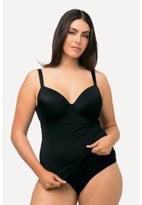 Maillot de bain une pièce noir avec des bonnets moulés, des bretelles réglables et une texture lisse, présentant un design ajusté et sans matériel visible.