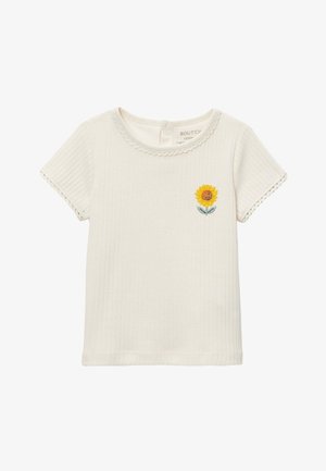 T-shirt bébé côtelé à manches courtes couleur crème avec bords festonnés et petite broderie de tournesol sur la poitrine.