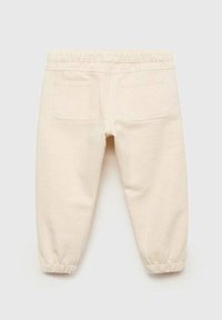 Pantaloni pentru copii de culoare crem, cu talie și manșete elastice, având două buzunare pătrate pe spate, pe un fundal plain.