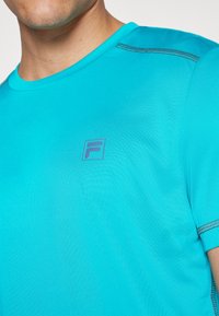 Fila JANNIS - Sports T-shirt - capri breeze
