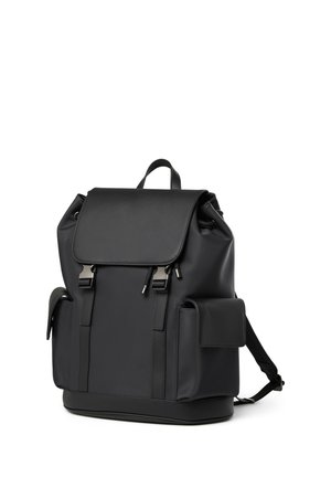Black leather backpack with flap closure, two front metal buckles, side pockets, and adjustable shoulder straps on white background.