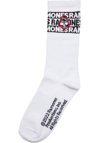 Weiße Baumwollsocke mit einem schwarz-rot grafischen Design, das das Wort "MONSTER" und ein Katzenlogo zeigt. Die Socke hat eine strukturierte Naht und einen gerippten Bund.