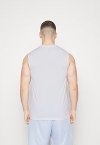 Sleeveless athletic shirt in light gray fabric, featuring a round neck and a fitted design. The back is smooth with no visible seams or patterns.