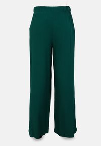 Wide-leg pants in deep green fabric with an elastic waistband. Features side pockets and a smooth texture. Straight cut extends to the floor.