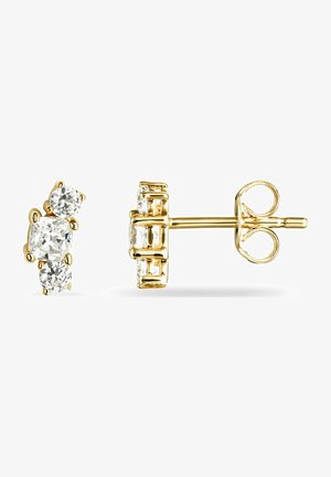 Guld-tone stud øreringe med tre klare, runde cubic zirconia sten i et klynge-design. Glat metalfinish med sikker baggrund.