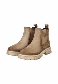 Botas de tobillo de ante marrón con paneles elásticos en los lados y tiradores, que presentan una gruesa suela de goma beige con un patrón de relieve.