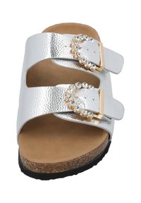 Silver metallic sandals with two adjustable straps, featuring rhinestone accents, cork footbed, and black outsole.