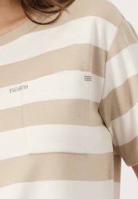 Beige and white striped short-sleeve shirt with a front pocket and small decorative studs on the pocket. Soft, lightweight material.