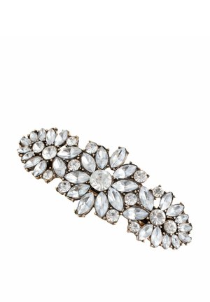 Clip barrette decorated with clear gemstone clusters arranged in floral patterns on a gold-tone metal base.