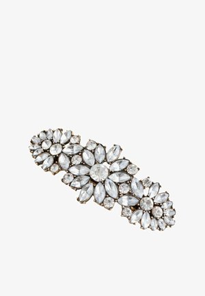 Clip barrette decorated with clear gemstone clusters arranged in floral patterns on a gold-tone metal base.