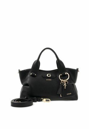Sac à main Guess en cuir noir avec double poignées, logo doré, breloques décoratives pour porte-clés et une bandoulière détachable à côté.
