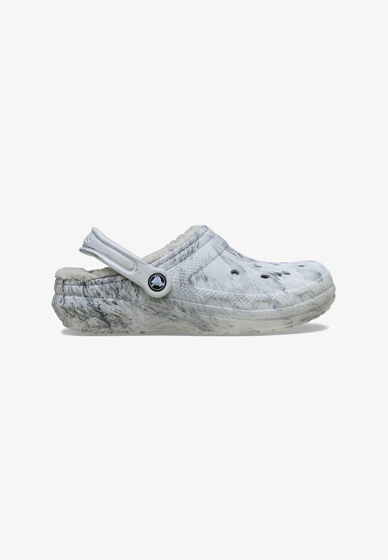 White marbled clogs with a soft, fuzzy lining, ergonomic shape, and ventilation holes, featuring a detachable heel strap and logo accent.