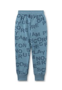 Blaue Kinder-Jogginghosen mit einem elastischen Bund und Bündchen, die mit einem verteilten Druck in Marineblau versehen sind, auf dem Wörter wie "SPIELEN", "TEAM" und "PUNKTE" zu sehen sind.