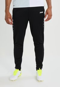 Zwarte sportbroeken met een slim fit ontwerp, voorzien van branding op de linker bovenbeen, witte accentpunten langs de zijkant en rekbaar, textuurstof.